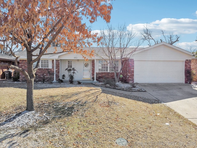 ranch-style house with a garage and a front yard