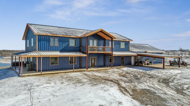 9501 S 4170th Rd, Claremore, OK 74017 - view of front of home with metal roof, a carport, a porch, central AC, and a balcony