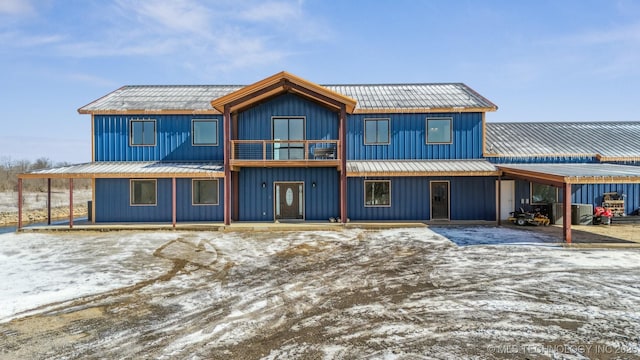 9501 S 4170th Rd, Claremore, OK 74017 - view of front facade with metal roof and board and batten siding