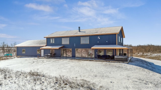 9501 S 4170th Rd, Claremore, OK 74017 - snow covered property with metal roof and a jacuzzi