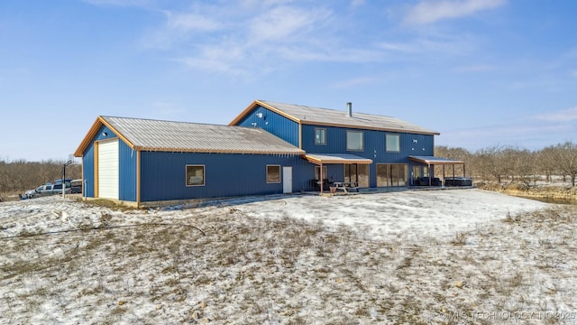 9501 S 4170th Rd, Claremore, OK 74017 - snow covered back of property featuring metal roof