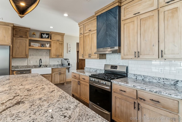 kitchen with open shelves, appliances with stainless steel finishes, light stone counters, a sink, and under cabinet range hood