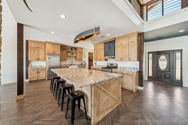 9501 S 4170th Rd, Claremore, OK 74017 - kitchen with stainless steel appliances, a sink, baseboards, a center island, and open shelves