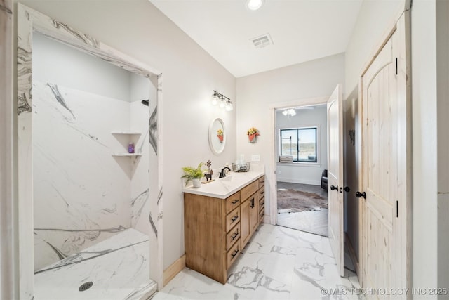 9501 S 4170th Rd, Claremore, OK 74017 - full bathroom with marble look tiles, vanity, and a marble finish shower