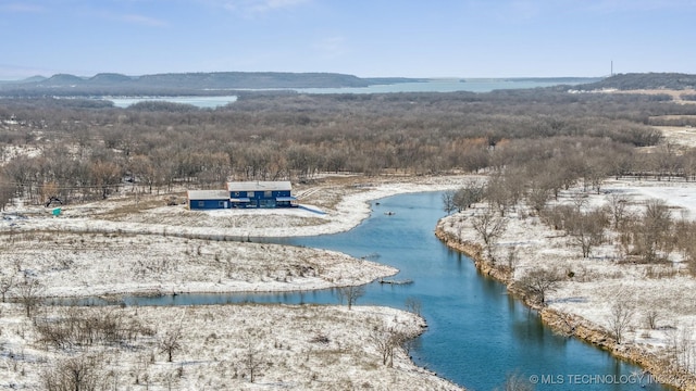 drone / aerial view with a water and mountain view