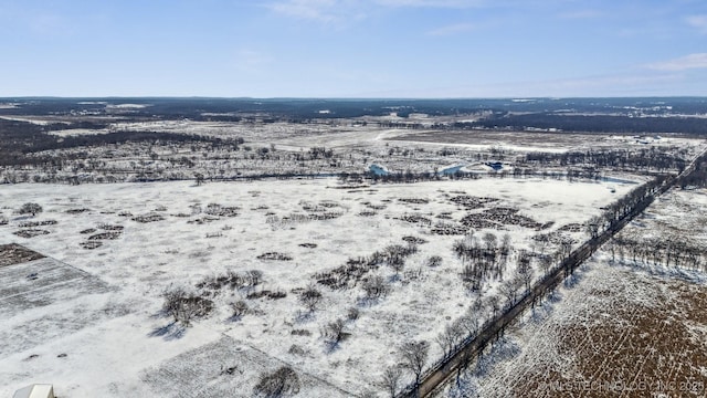 snowy aerial view featuring a rural view