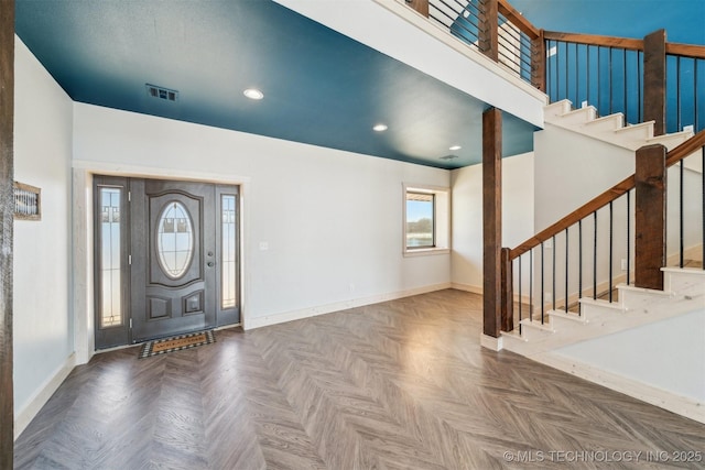 foyer featuring recessed lighting, baseboards, visible vents, and stairway