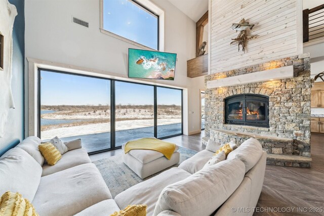 9501 S 4170th Rd, Claremore, OK 74017 - living room with a towering ceiling, a stone fireplace, and a water view