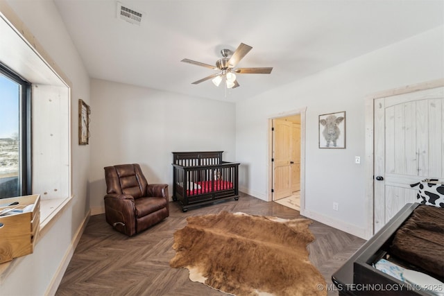 bedroom featuring a ceiling fan, baseboards, and visible vents