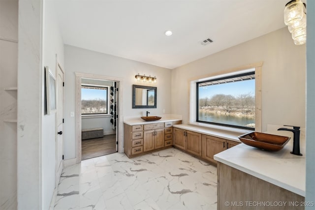 9501 S 4170th Rd, Claremore, OK 74017 - full bath featuring vanity, recessed lighting, and marble look tiles