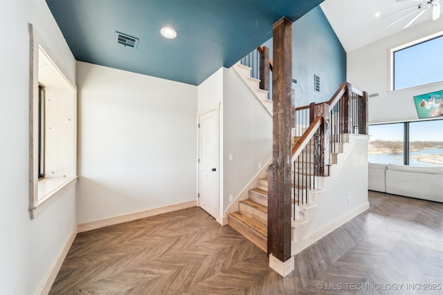 9501 S 4170th Rd, Claremore, OK 74017 - stairway featuring baseboards, a towering ceiling, and recessed lighting