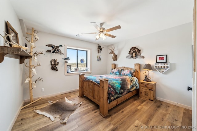 9501 S 4170th Rd, Claremore, OK 74017 - bedroom featuring light wood-type flooring, baseboards, and ceiling fan