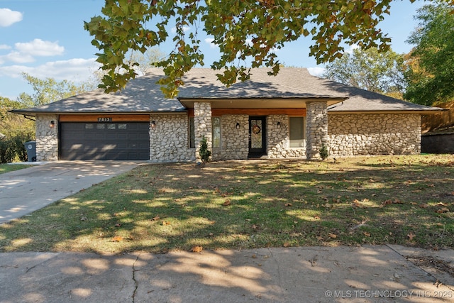 view of front of house with a garage and a front yard