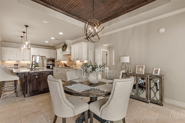 dining space featuring a notable chandelier, a tray ceiling, ornamental molding, and wooden ceiling