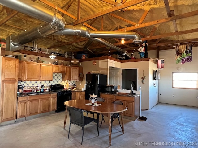 kitchen with tasteful backsplash, sink, and black appliances