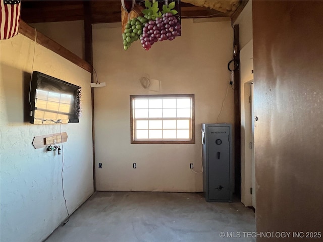 spare room with concrete floors