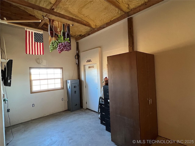 unfurnished bedroom featuring concrete flooring