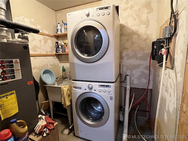 laundry room with stacked washer / dryer