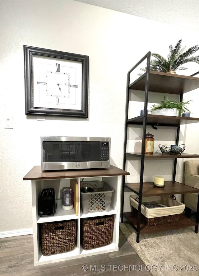 6663 S Victor Ave Unit H # 305, Tulsa, OK 74136 - detailed view of stainless steel microwave and wood finished floors