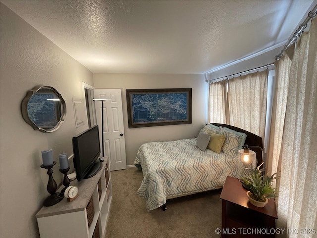 6663 S Victor Ave Unit H # 305, Tulsa, OK 74136 - carpeted bedroom with a textured ceiling