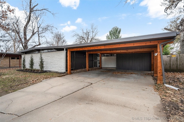 garage featuring a carport