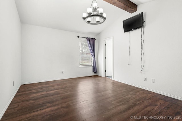 unfurnished room featuring dark hardwood / wood-style flooring, lofted ceiling with beams, and a chandelier