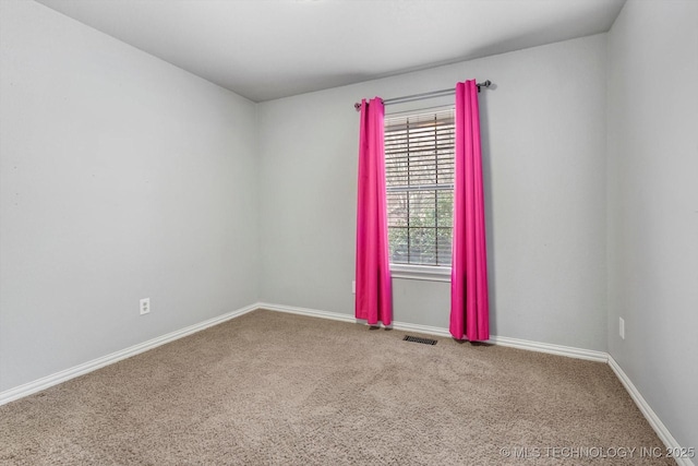 spare room featuring carpet floors