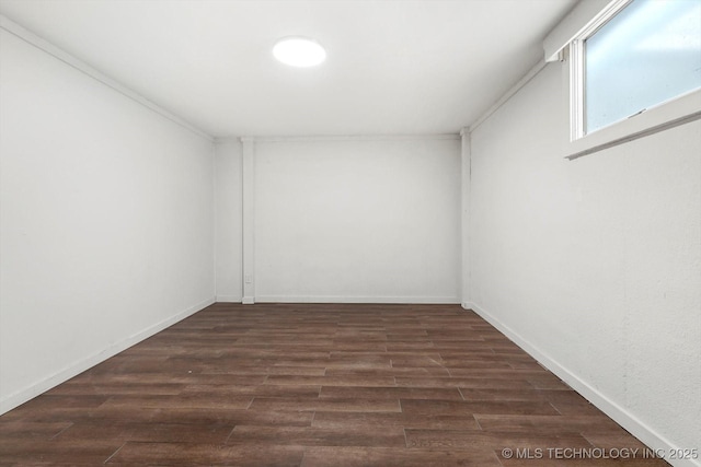 spare room with dark wood-type flooring