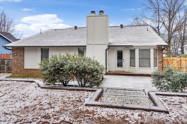 rear view of house with a wooden deck