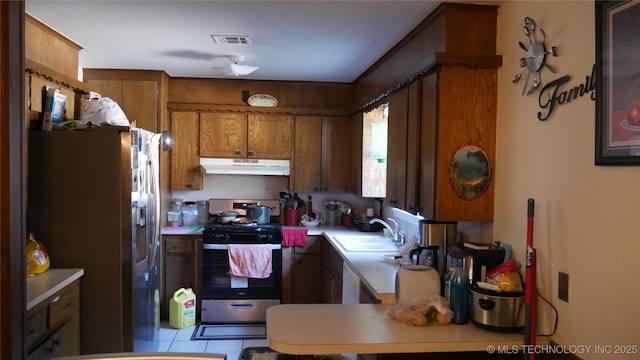 kitchen featuring appliances with stainless steel finishes and sink