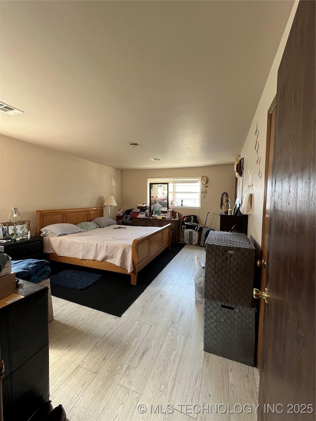 bedroom with light hardwood / wood-style flooring