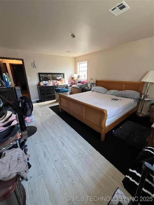 bedroom featuring light hardwood / wood-style flooring