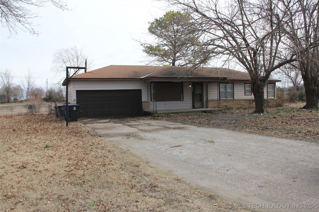 ranch-style home featuring a garage