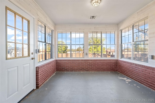 unfurnished sunroom with plenty of natural light