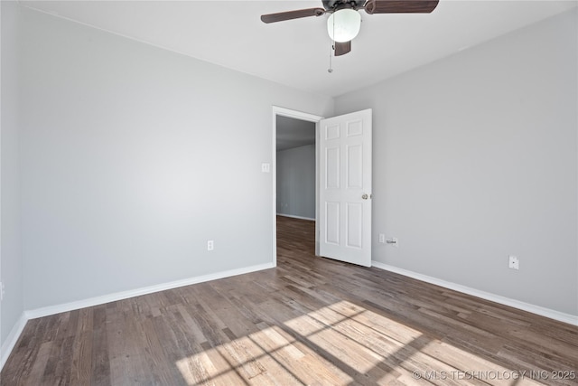 unfurnished room featuring hardwood / wood-style flooring and ceiling fan