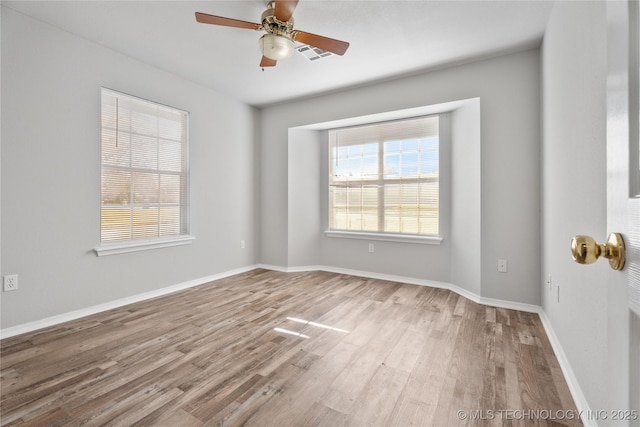 empty room with ceiling fan and light wood-type flooring