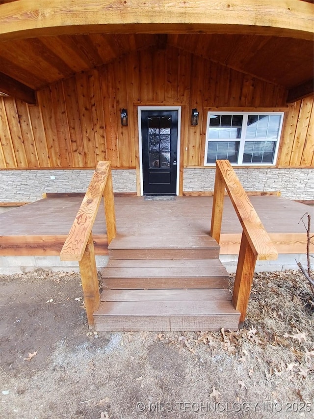 view of exterior entry featuring a porch