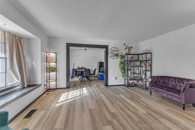 sitting room with light hardwood / wood-style floors