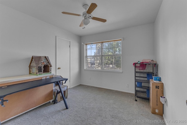 home office featuring carpet flooring and ceiling fan