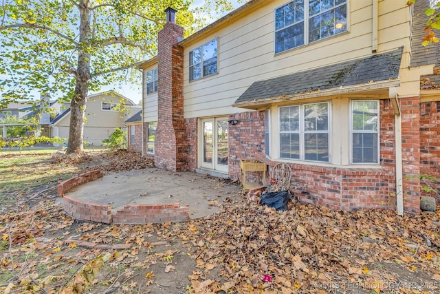 back of property featuring a patio