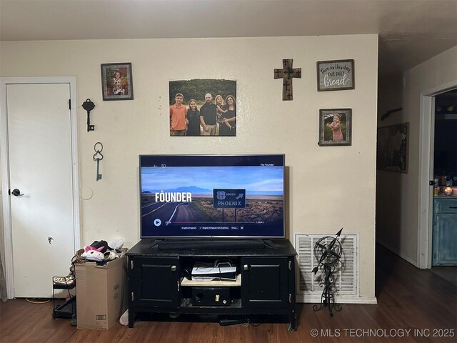 living room with dark hardwood / wood-style floors