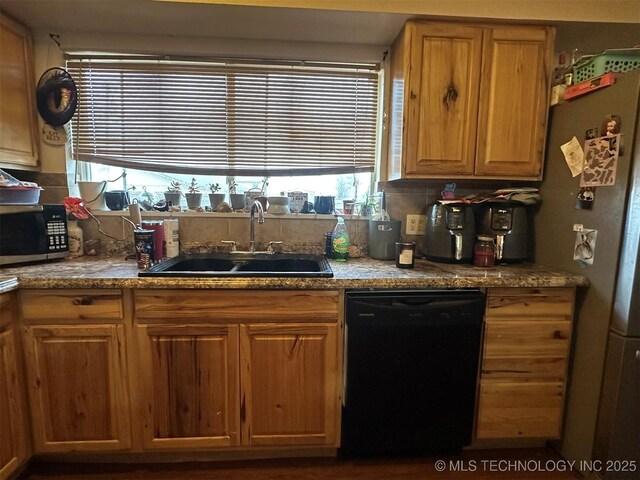 kitchen featuring sink, backsplash, and appliances with stainless steel finishes