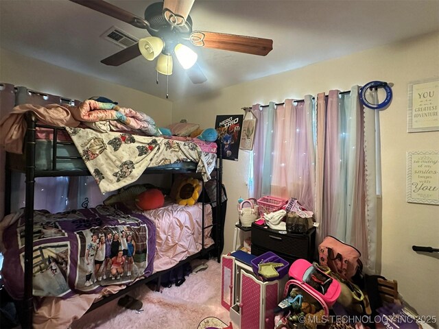 carpeted bedroom with ceiling fan