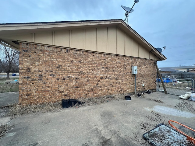 view of property exterior with a patio area