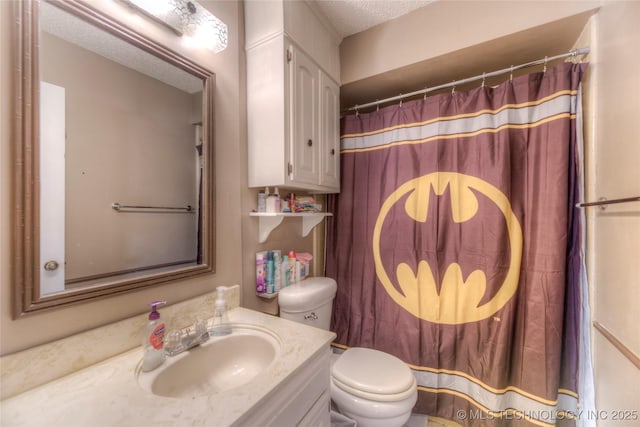 bathroom with walk in shower, vanity, toilet, and a textured ceiling