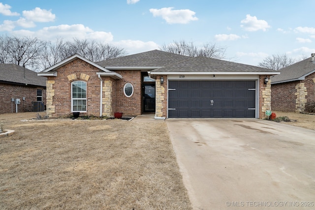 ranch-style home featuring driveway, a shingled roof, an attached garage, central air condition unit, and brick siding