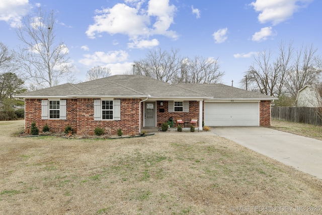 single story home featuring a garage and a front yard