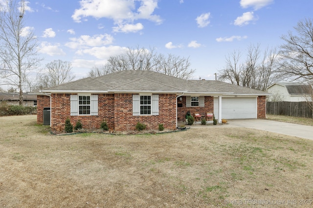 ranch-style home with a garage, a front yard, and central air condition unit