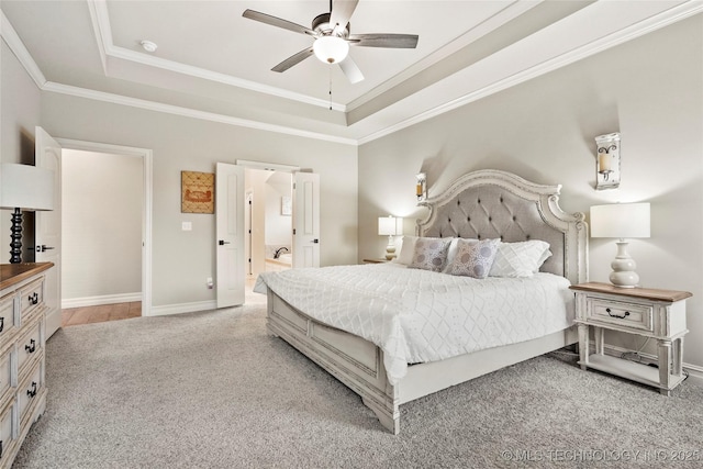 bedroom featuring light carpet, crown molding, a raised ceiling, and ceiling fan