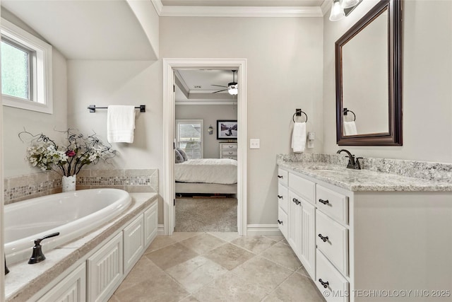 bathroom featuring ornamental molding, a washtub, and vanity